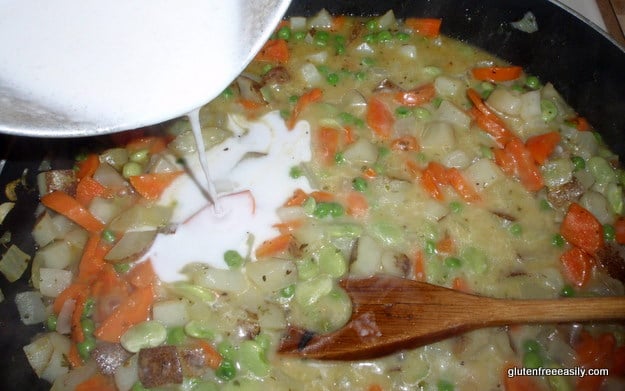 Adding the special ingredient that makes the thick creamy sauce for this Gluten-Free Pot Pie (Chicken, Turkey, or Vegan). That makes it taste amazing! [from GlutenFreeEasily.com]