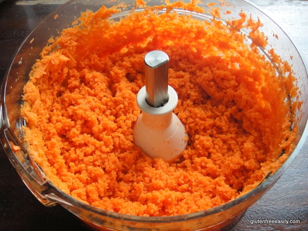 The glorious color or grated carrots for Gluten-Free ABC Muffins.