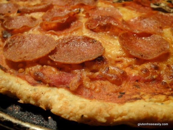 Gluten-free Chewy Cheesy Pizza Crust. This crust is perfectly cheesy, chewy, and not too thin or too thick, and look at those crispy edges! Plus, it's yeast free and quick and easy!