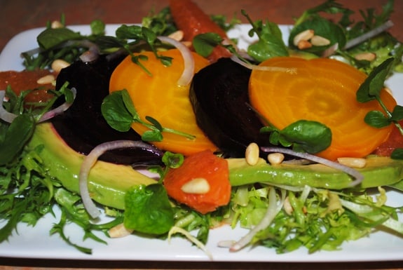 Eating real food, such as this Roasted Red and Yellow Beet Salad with Avocado, Oranges, Red Onion, and Toasted Pine Nuts, is a huge part of Diane Eblin's personal gluten-free story.