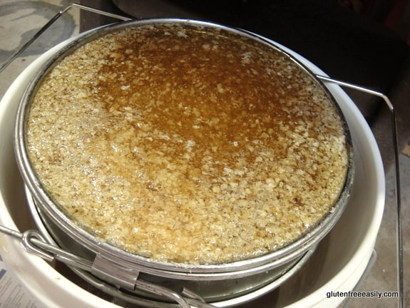 Raising Honey Bees and Harvesting Their Honey. The strainer catches all the wax.