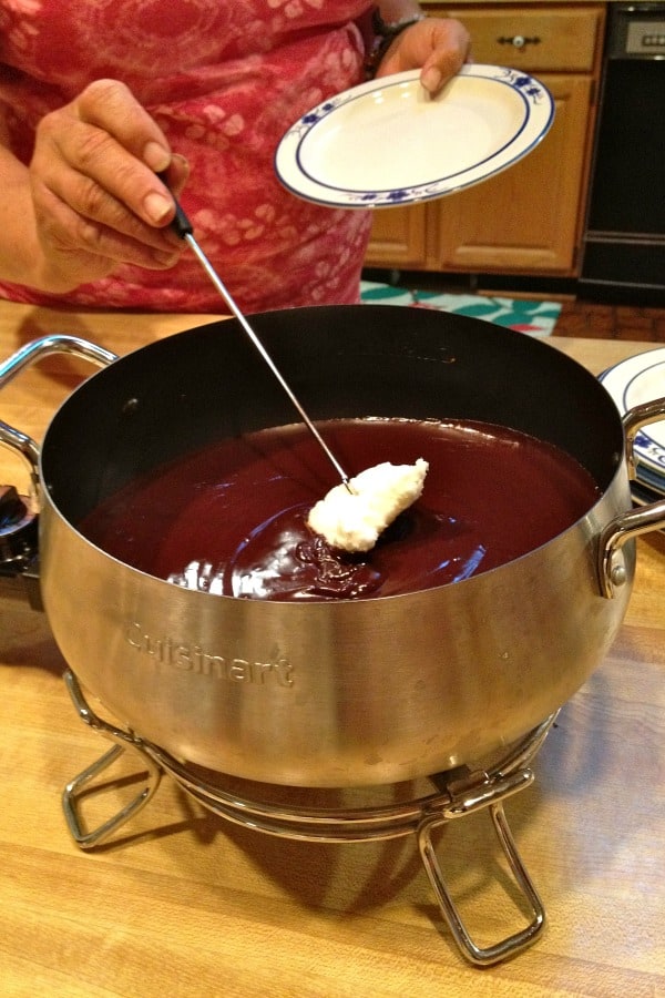 Dipping gluten-free angel food cake into gluten-free chocolate fondue. Yum!