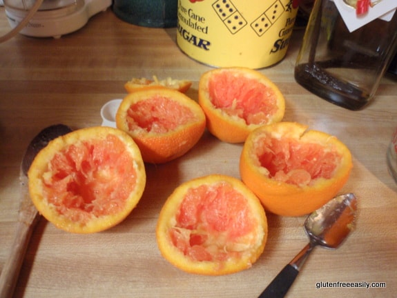 Hollowing out the oranges for Frozen Orange Kiss Desserts. They are the perfect way to end a special meal! Lovely and refreshing. Naturally gluten free, but loved by all. Use store-bought orange sherbet if you prefer. [from GlutenFreeEasily.com]