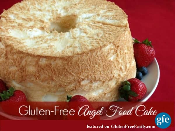 Gluten-free Angel Food Cake from Linda Etherton. Gluten-free, dairy-free Angel Food Cake on a white plate with strawberries and blueberries. Better than gluten-free Angel Food Cake!