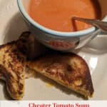 Gluten-Free Cheater Tomato Soup. Almost instant with just two ingredients. In a blue flowered bowl with grilled gluten-free cheese sandwich on white plate.