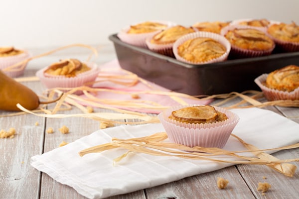 These gluten-free Vanilla Pear Muffins are grain-free muffins made with coconut flour, lemon zest, vanilla & fresh pears. Perfect for traveling, lunches, or a sweet afternoon snack! [featured on GlutenFreeEasily.com]