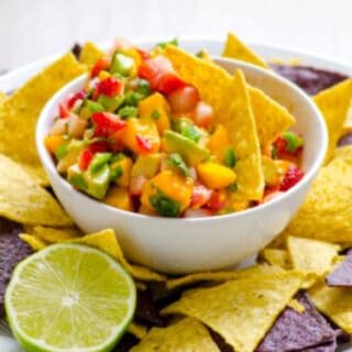 Strawberry Mango Summer Salsa. You won't be able to stop eating this salsa once you start! Lots of fruitiness, plus avocado, heat, and cilantro. Featured on GlutenFreeEasily.com.