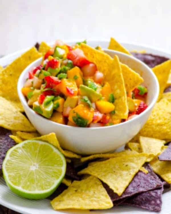 Strawberry Mango Summer Salsa. You won't be able to stop eating this salsa once you start! Lots of fruitiness, plus avocado, heat, and cilantro. Featured on GlutenFreeEasily.com.