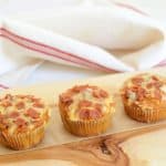 Low-Carb Pizza Muffins recipe. This easy muffin recipe is made with 8 ingredients total. All you need to throw it together is almond flour, eggs, tomato sauce, Parmesan, cheddar, pepperoni, salt, and baking soda. One of 20 gluten-free muffin recipes featured on gfe for March Muffin Madness.