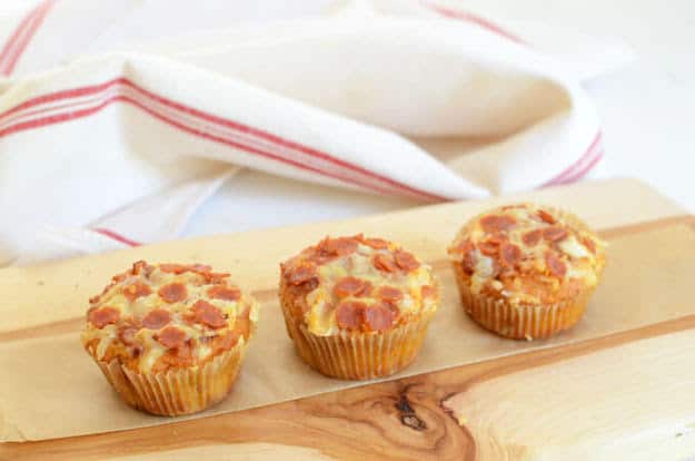 Low-Carb Pizza Muffins recipe. This easy muffin recipe is made with 8 ingredients total. All you need to throw it together is almond flour, eggs, tomato sauce, Parmesan, cheddar, pepperoni, salt, and baking soda. One of 20 gluten-free muffin recipes featured on gfe for March Muffin Madness.