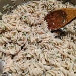 Easy Gluten-Free Parmesan Noodles with Wooden Spoon in Cooking Pot. Just a few ingredients to make this delicious dish! [from GlutenFreeEasily.com]