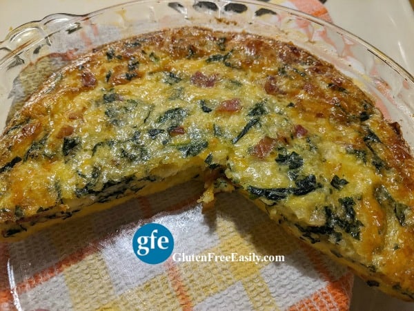 https://glutenfreeeasily.com/wp-content/uploads/2020/05/Crustless-Gluten-Free-Spinach-Quiche-Half-Gone-600WM-Photo.jpg