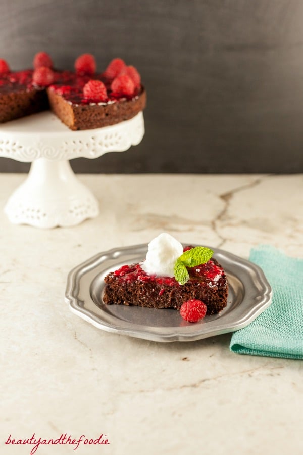 Scrumptious gluten-free raspberry cake. Chocolate with raspberry sauce.