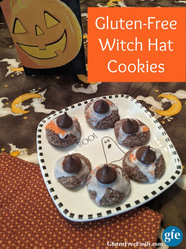 Gluten-Free Witch Hat Cookies on a Boo! Halloween plate on a ghost tablecloth with jack-o-lantern Halloween card.