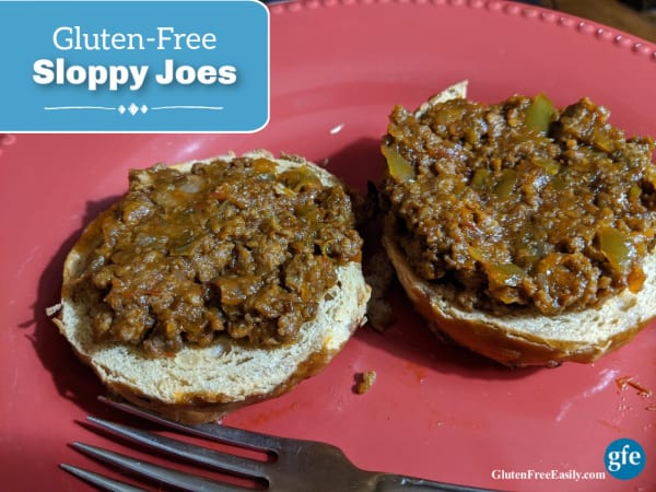 Quick and Easy Gluten-Free Sloppy Joes on an onion Odd Bagel on a salmon plate with fork.