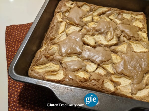 Pan of finished gluten-free Caramel Apple Squares on rust-colored Fall napkin.