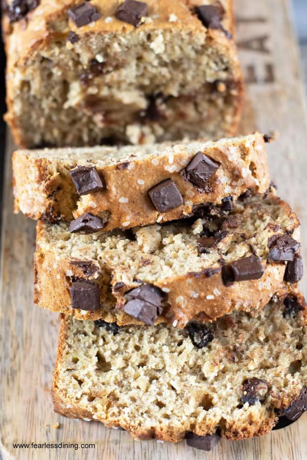 Sliced loaf of gluten-free banana bread with chocolate chunks.