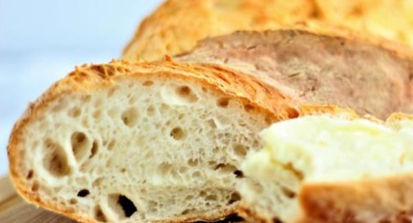 Sliced Gluten-Free French Bread. One of the gluten-free French bread and baguette recipes featured on gfe.