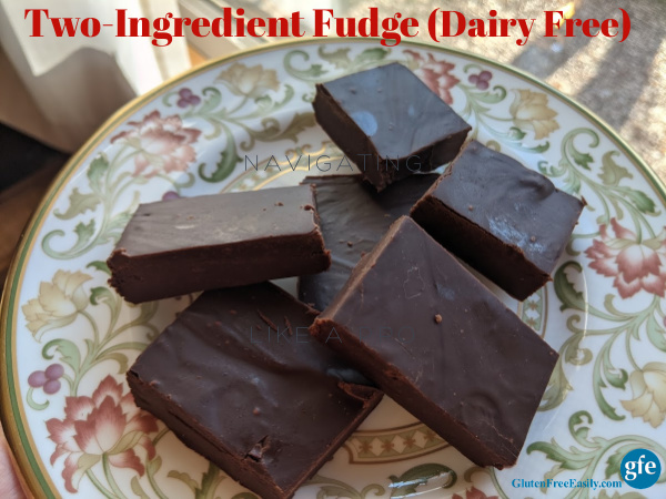 Six pieces of Dairy-Free Two-Ingredient Fudge piled on a Litchfield china bread and butter plate next to a window.