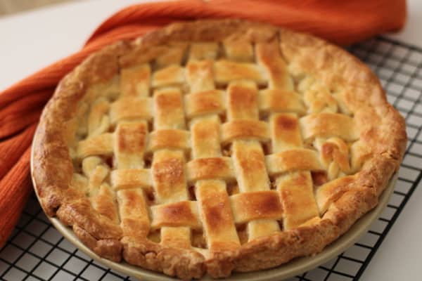 Gluten-Free Peach Pie with Lattice Crust from The Nomadic Fitzpatricks. One of many wonderful gluten-free peach pie recipes in this collection on Gluten Free Easily (gfe).