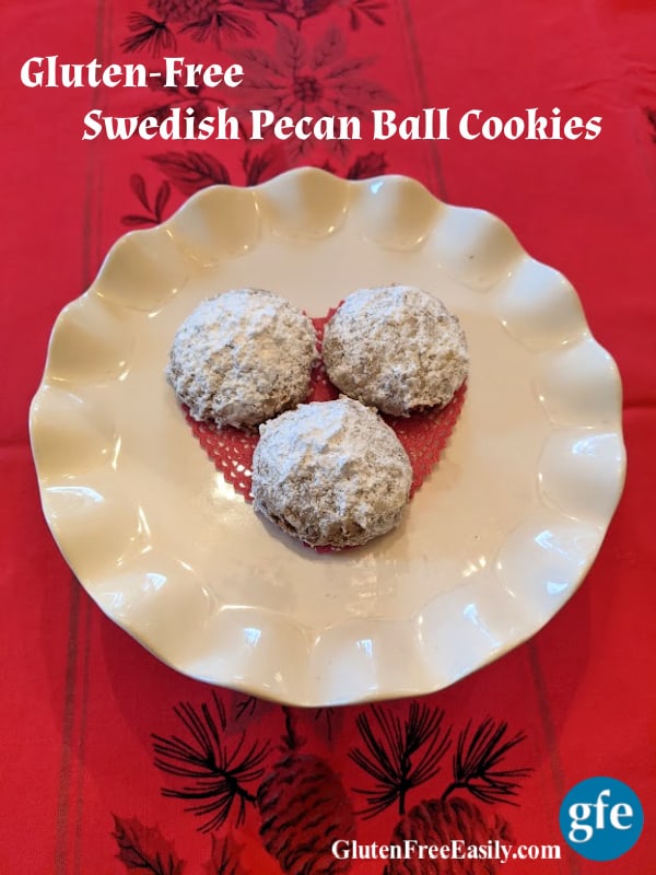Gluten-Free Swedish Pecan Ball Cookies on small white ruffled dessert stand.