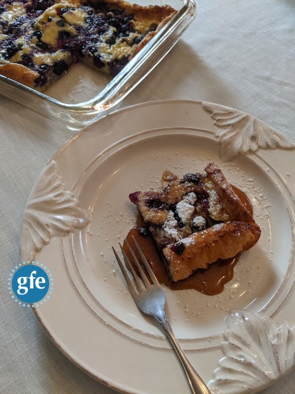 Gluten-Free Blueberry Volcano Pancake right out of the oven. So delicious! I love the corner and edge pieces for that little bit of crusty goodness! p.s. Some of you may call this a Dutch baby, puff pancake, Yorkshire pudding, or another name.