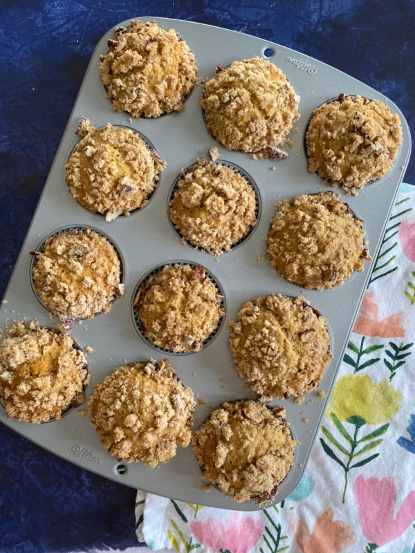 Gluten-Free Banana Streusel Muffins with Flaxseed ready to eat! Place on a flowered hand towel.