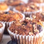 Gluten-Free Keto Blueberry Streusel Muffins side by side on counter.