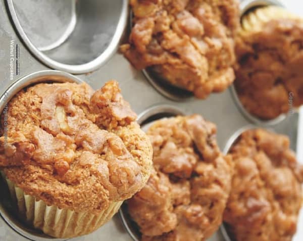 Gluten-Free Sweet Potato Muffins with Walnut Crumb Topping. Popping out of the muffin tin!
