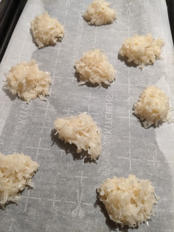 Flourless Gluten-Free Coconut Macaroons made with Bakers Angel Flake Sweetened Coconut on baking sheet getting ready to go in the oven.