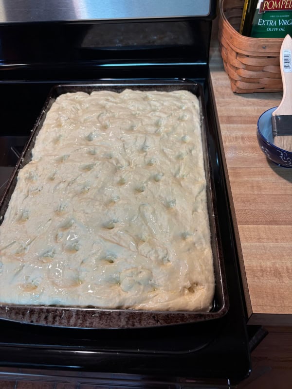 Gluten-Free Focaccia dough all olive oiled, salted, seasoned, and ready to go in the oven.