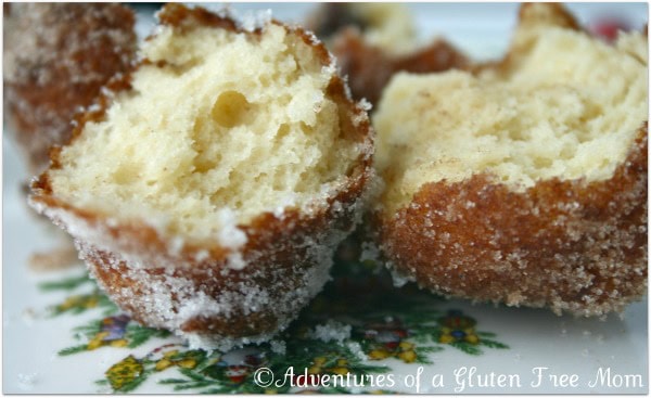 Gluten-Free Fritters close-up, broken in half, on a holiday plate.