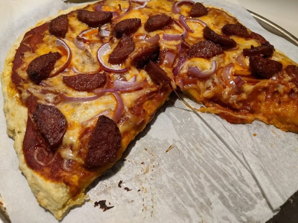 Gluten-free Chewy Cheesy Pizza Crust. This crust is perfectly cheesy, chewy, and not too thin or too thick, and look at those crispy edges! Plus, it's yeast free and quick and easy! How will you tops yours?