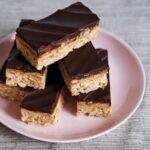 Gluten-Free Peanut Butter Truffle Crispy Rice Bars. Peanut butter and chocolate meet rice krispy treats for a trifecta of goodness. [featured on GlutenFreeEasily.com]